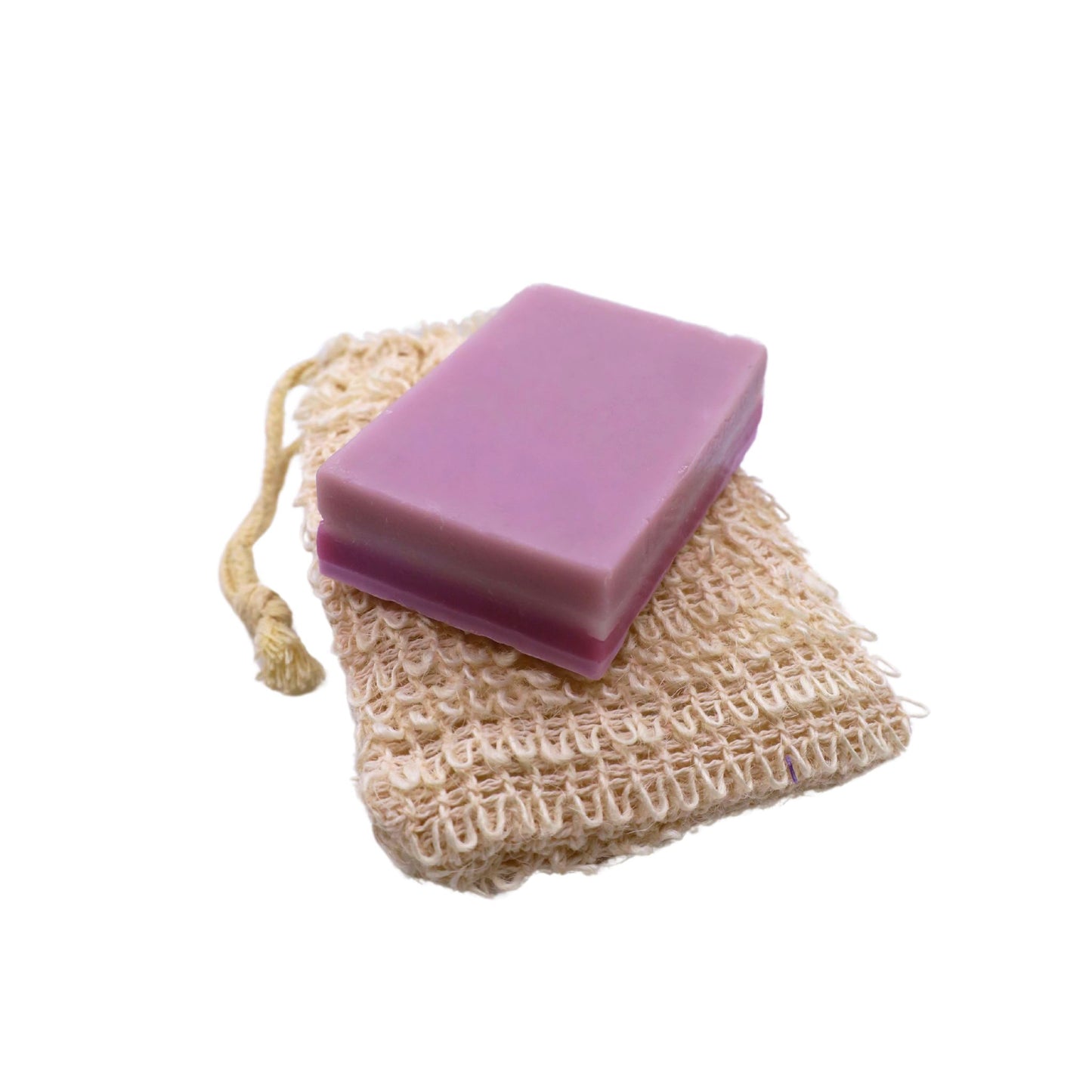 A bar of premium CBD bar soap sitting on top of a hemp made loofah bag sitting on a white background.