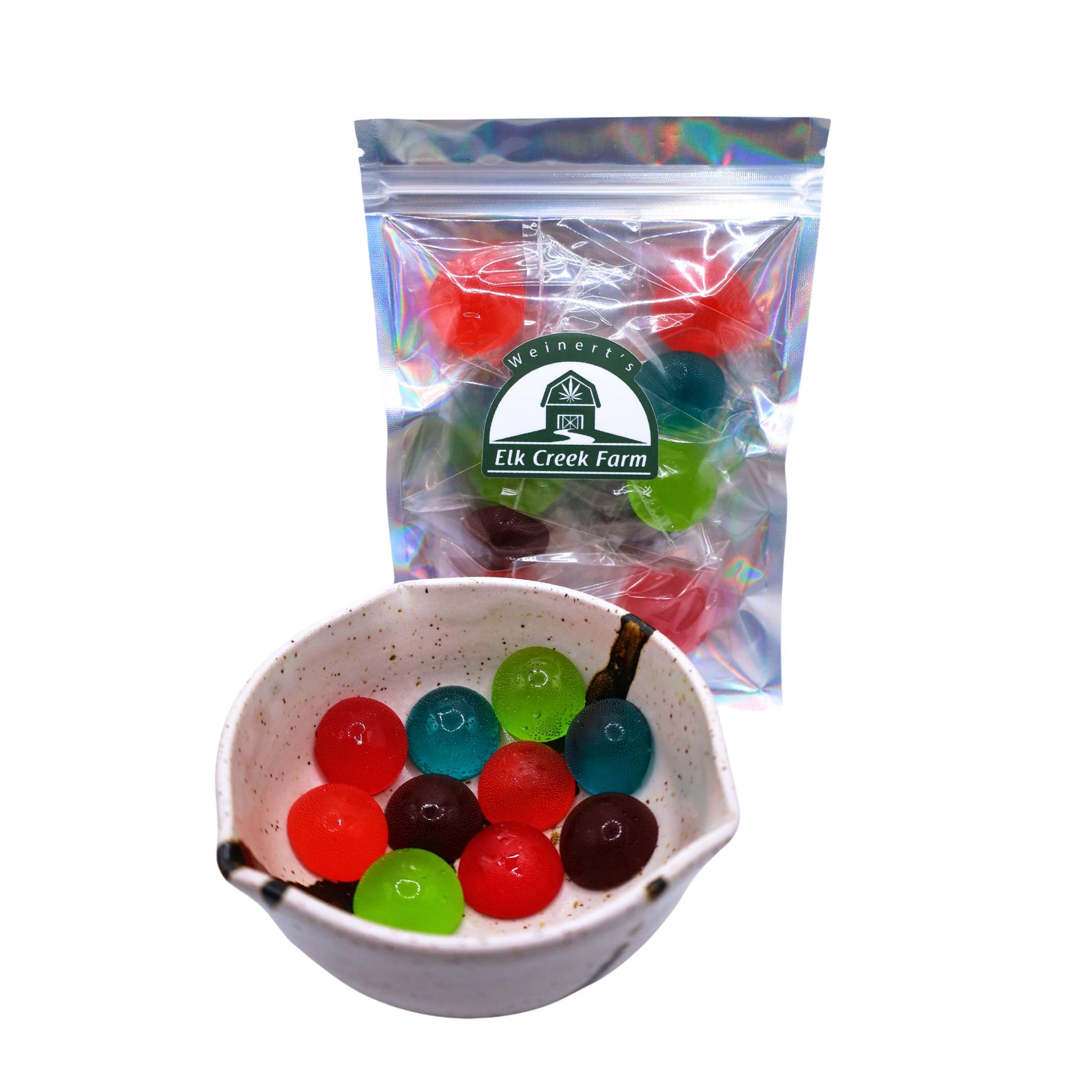 A package of premium infused CBD Hard Candies next to a bowl full of hard candy